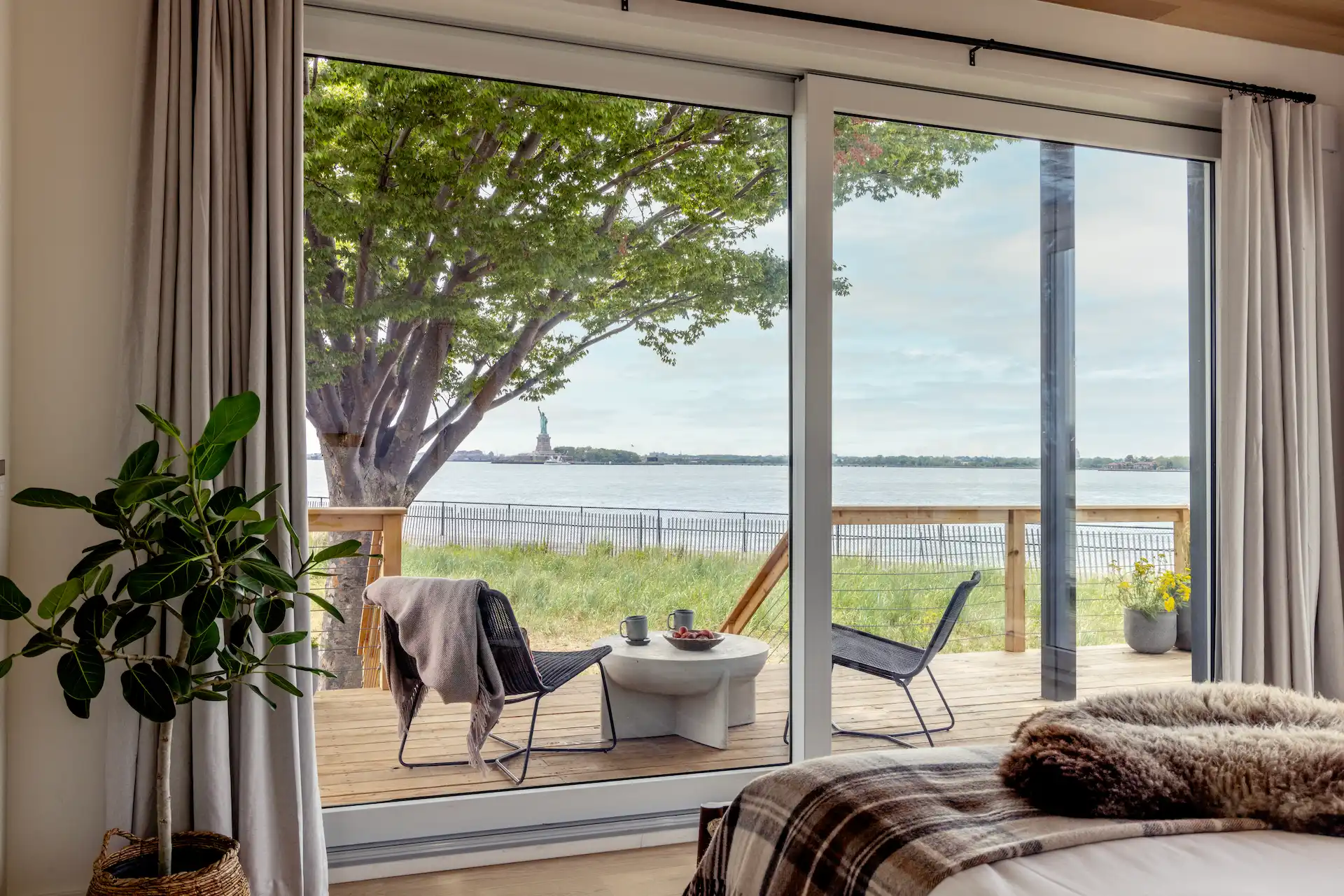 Outlook Liberty Suite porch from interior at Governors Island by Collective Retreats