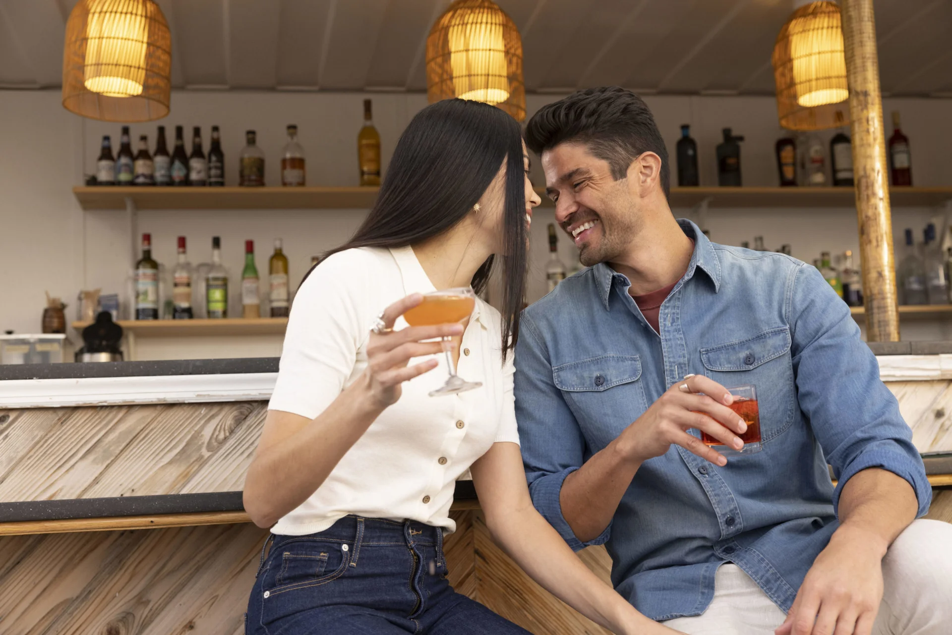 Woman and man smiling and looking at each other