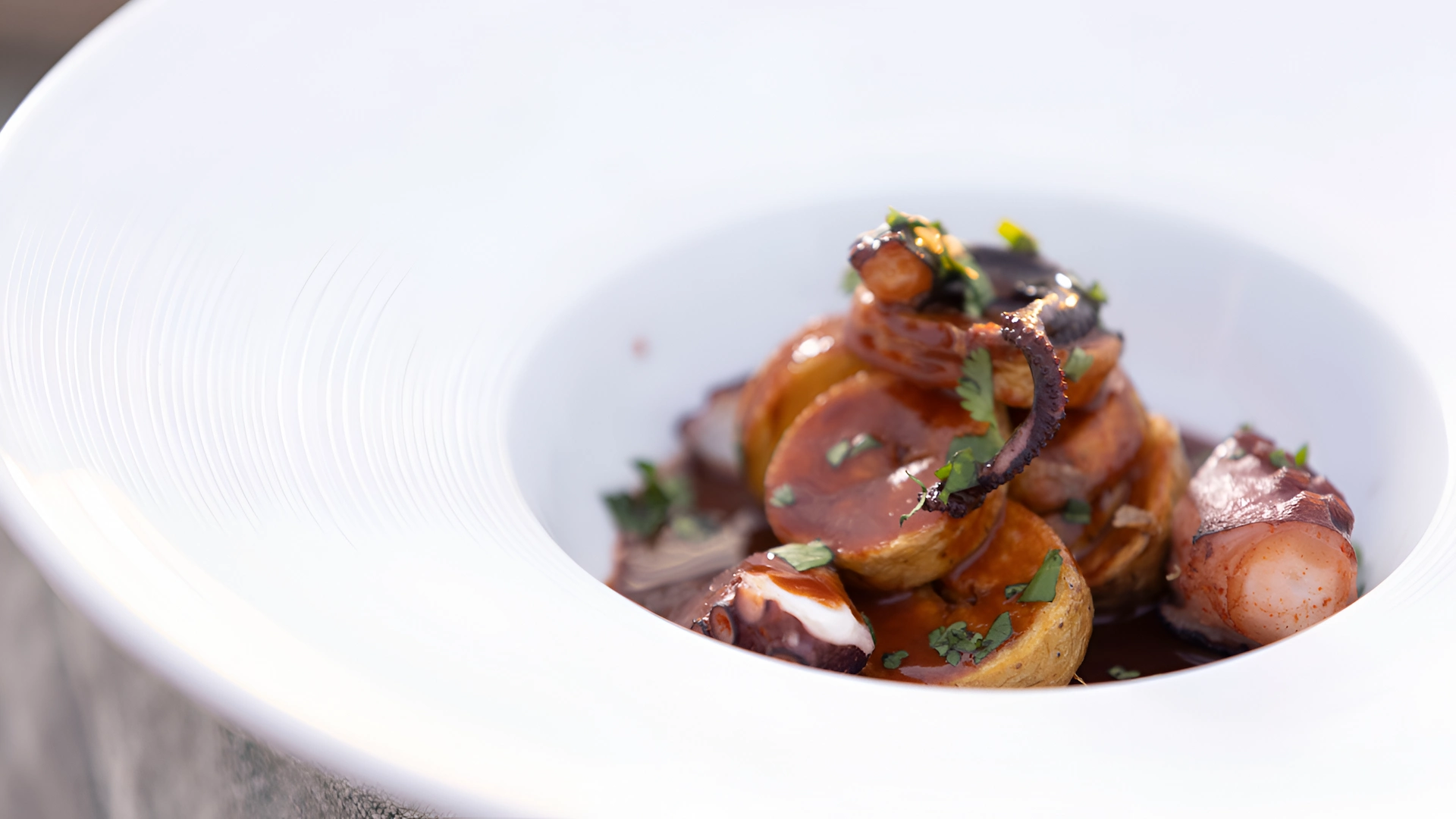 Octopus with Sauce and Roasted Potatoes Served Elegantly