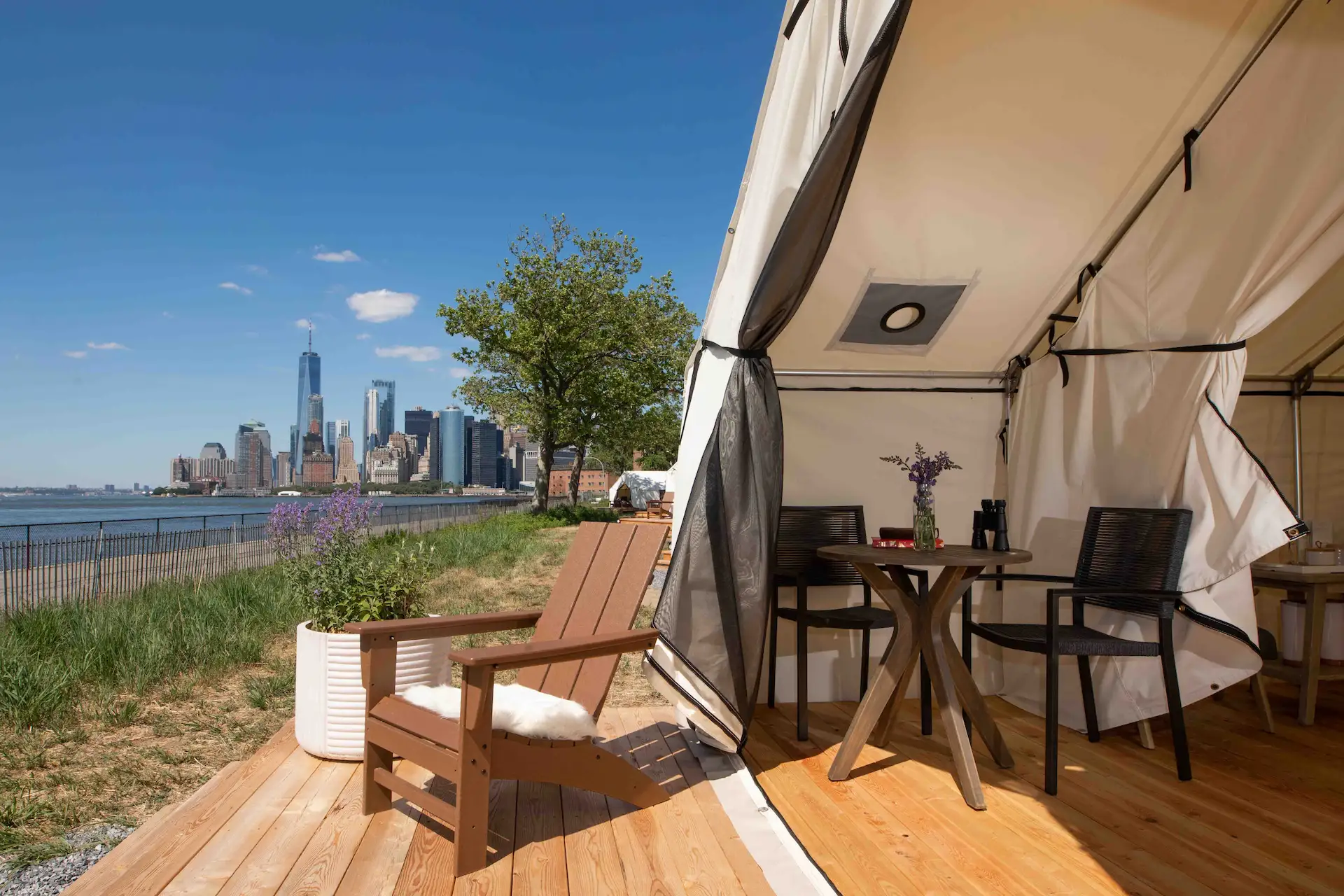 Camp with a cityscape of New City in the background.