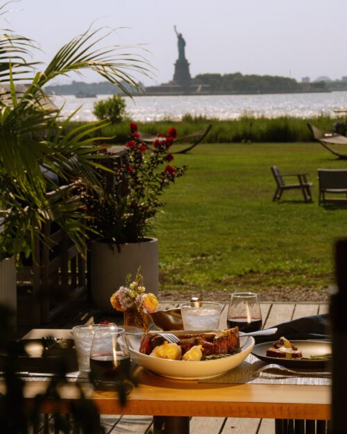View of the Statue of Liberty over a dining table